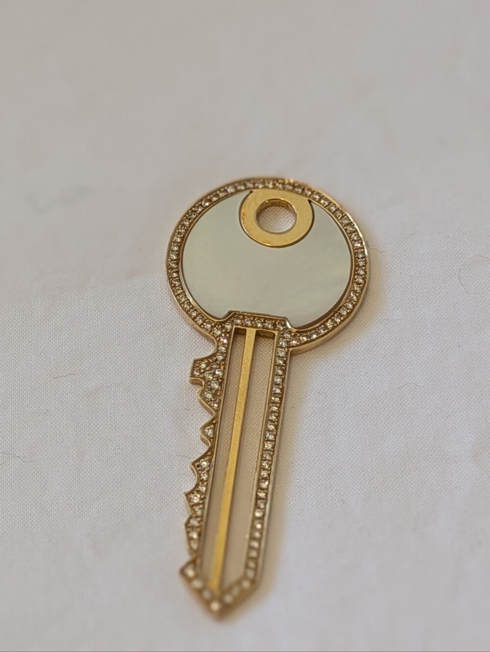 Victoria Casal 18k gold pendant, shaped as a key